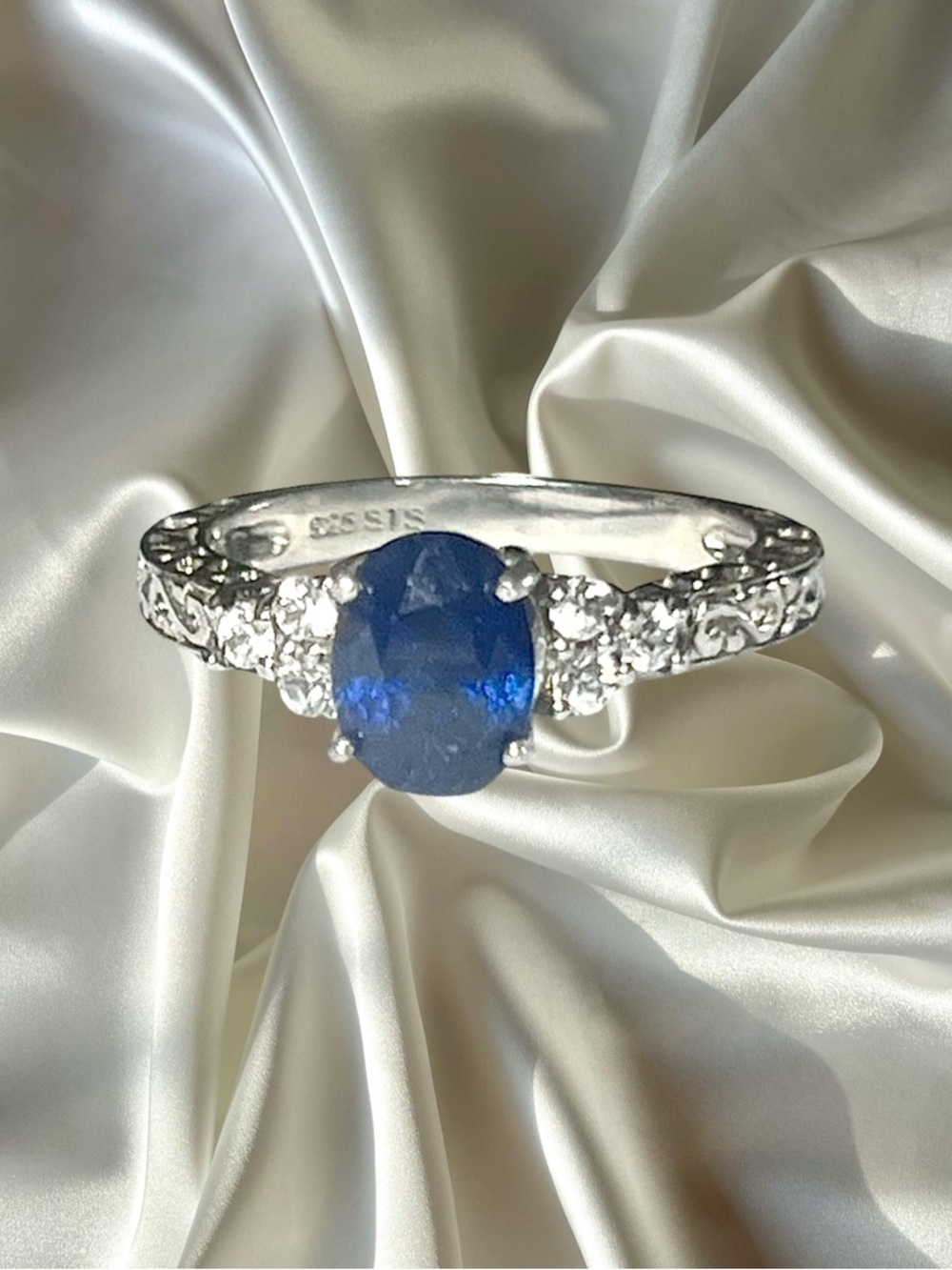 Chuck Clemency Sterling Silver Lab Blue Sapphire Oval Ring with Accent CZ Stones